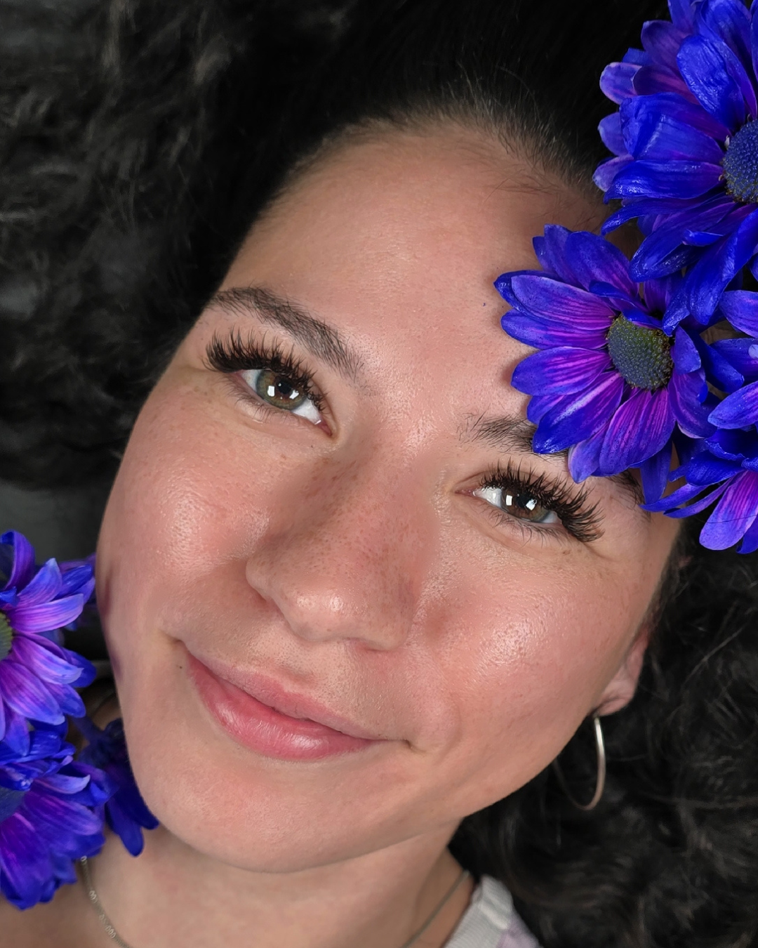Wispy volume lash extensions with fluttery fans and tapered ends, close-up